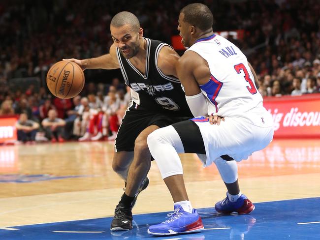 Chris Paul earns his pay cheque with some defence on Spurs rival Tony Parker.