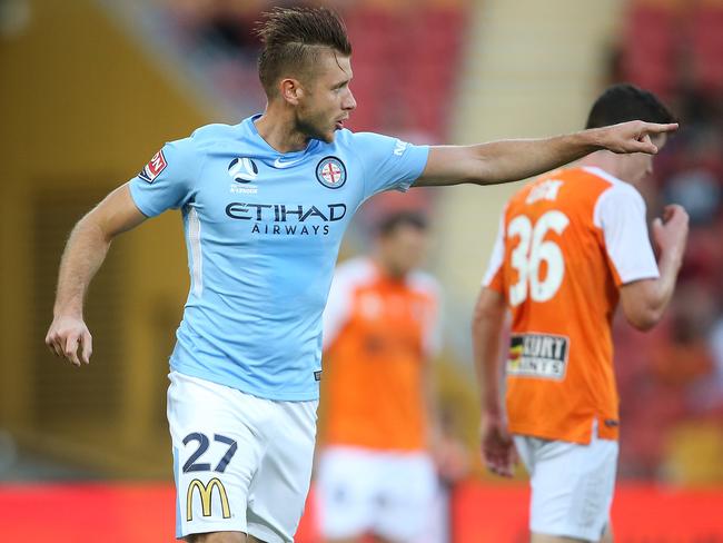 BRISBANE, AUSTRALIA - FEBRUARY 04: Melbourne player Marcin Budzinski celebrates a goal during the round 19 A-League match between the Brisbane Roar and Melbourne City at Suncorp Stadium on February 4, 2018 in Brisbane, Australia. (Photo by Jono Searle/Getty Images)