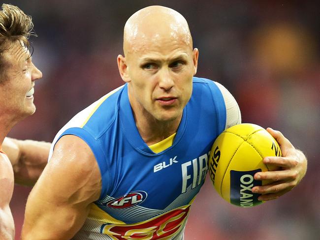 SYDNEY, NEW SOUTH WALES - MAY 14: Gary Ablett of the Suns is challenged by Rhys Palmer of the Giants during the round eight AFL match between the Greater Western Sydney Giants and the Gold Coast Suns at Spotless Stadium on May 14, 2016 in Sydney, Australia. (Photo by Matt King/AFL Media/Getty Images)