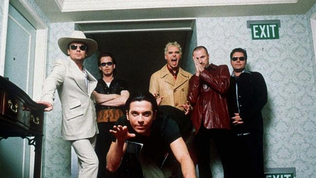 INXS in 1997 from left, Tim Farriss, Kirk Pengilly, Michael Hutchence, foreground, Jon Farriss, Garry Gary Beers and Andrew Farriss.