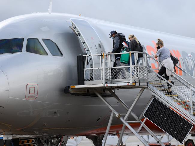 MELBOURNE,AUSTRALIA-NewsWire Photos NOVEMBER 23, 2020 : Borders around Australia begin to open up again during COVID-19. Passengers begin to board their Jetstar flight to Sydney at Melbourne Airport.Picture : NCA NewsWire / Ian Currie