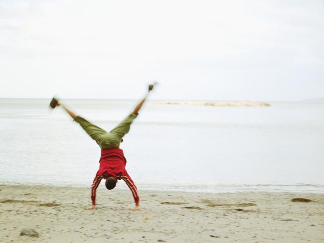Who doesn’t enjoy a cartwheel on the beach?
