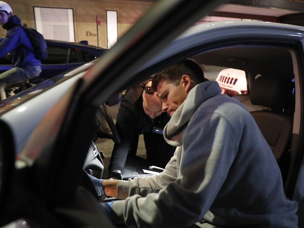 Redfern Region Enforcement Squad searching a car at about 5pm on Friday (14 May 2021), officers stopped a white Hyundai i30 near the intersection of King and Castlereagh Streets, Sydney, locating $5,150 cash. Picture: Jonathan Ng