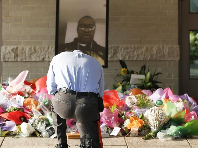 A mourner takes a moment before the funeral for George Floyd. Picture: AFP