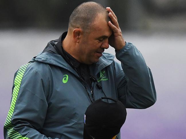 (FILES) This file photo taken on October 17, 2019 shows Australia's head coach Michael Cheika attending a training session at Matsuoka ground in the Japanese southern city of Oita during the Japan 2019 Rugby World Cup. - Australia coach Michael Cheika announced his resignation on October 20, 2019, a day after the Wallabies' defeat by England in the World Cup quarter-finals. (Photo by CHARLY TRIBALLEAU / AFP)