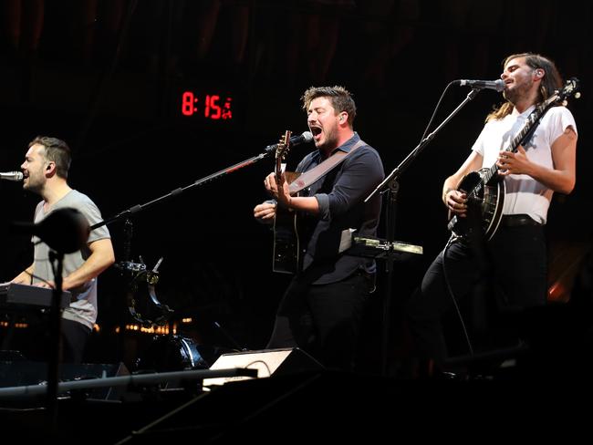 Winston Marshall on stage with two of his Mumford & Sons band mates. Picture: Rick Kern/Getty Images for Samsung
