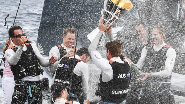 Sam Newton, second from left, and crewmates celebrate after winning the SailGP title.