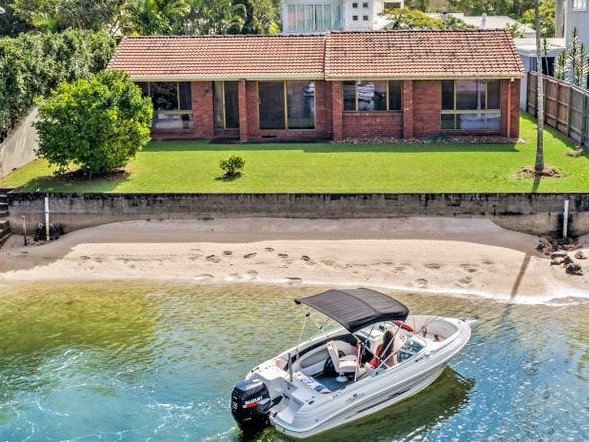 Position is everything in as this "modest" waterfront brick home goes under the hammer for $7.25m.