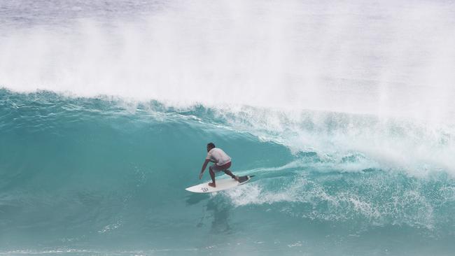 Surfers at Snapper Rocks and Kirra riding the Large swell produced by Cyclone OMA. Photograph : Jason O'Brien