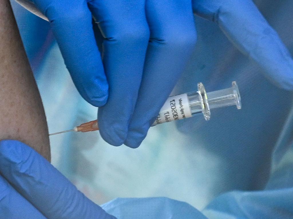 A flu vaccine is given in the US. Securing widespread immunisation is seen as key to ending the cycle of lockdowns. Picture: Robyn Beck / AFP