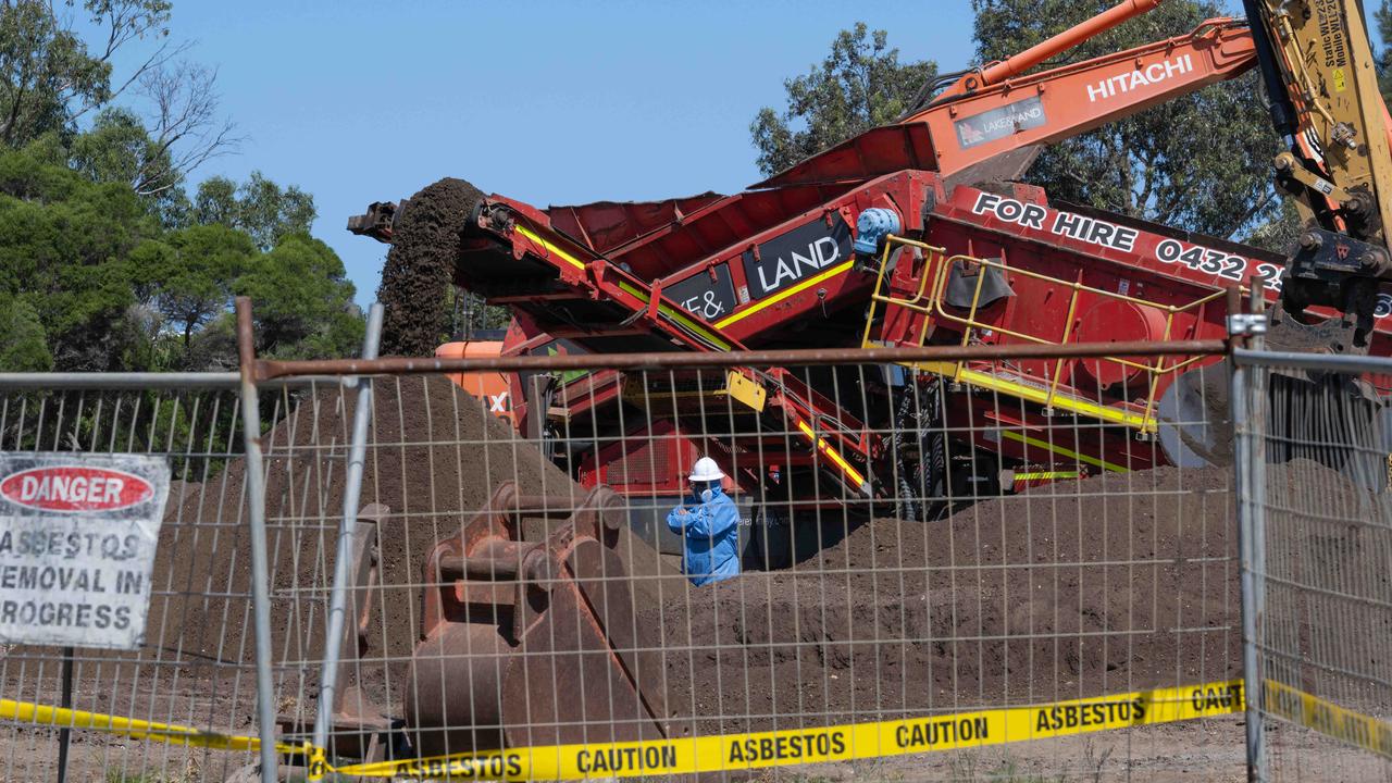 Workers in protective equipment at the building site in Murray Road, Queenscliff. Picture: Brad Fleet