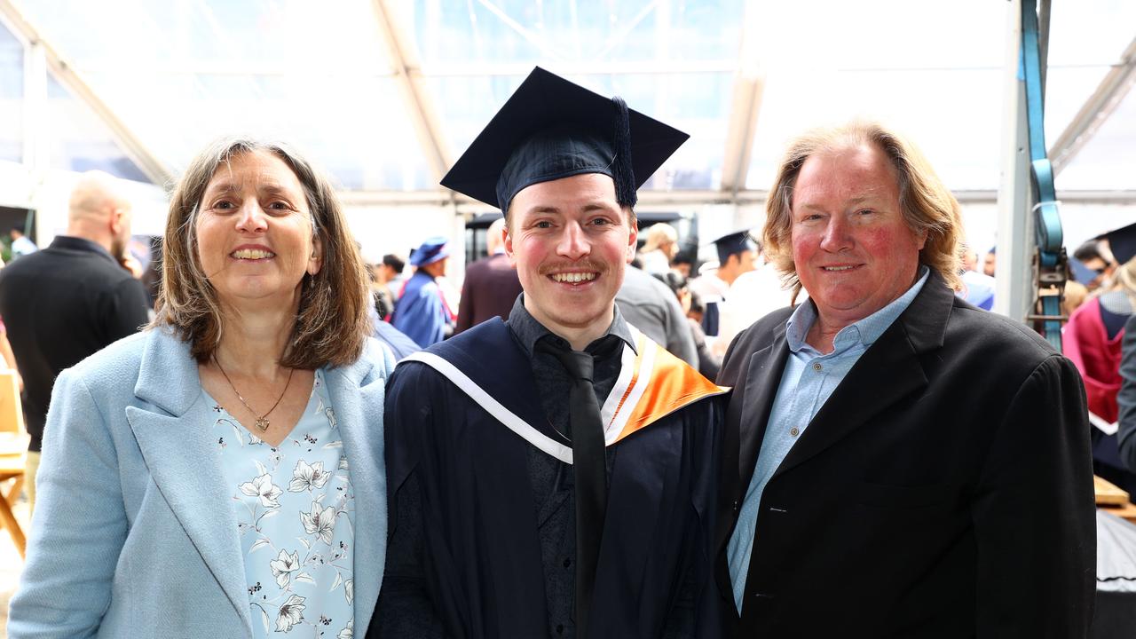 Deakin University graduate Aaron Vaughan with parents Paula and Ian of Leopold. Picture: Alison Wynd