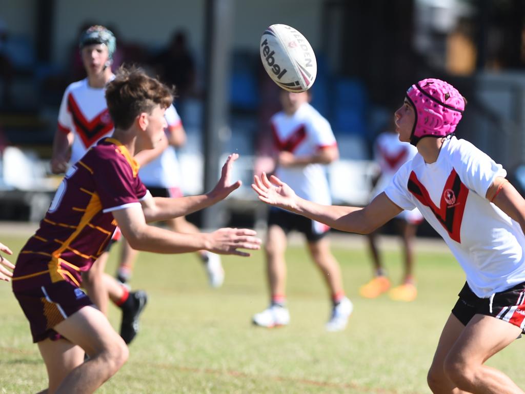 Boys Rugby League State Championship held at Northern Division, Brothers Leagues ground, Townsville. Northwest (maroon) v Wide Bay (white) 14-15 years. Nait Gough of Bundaberg SHS juggles the ball.