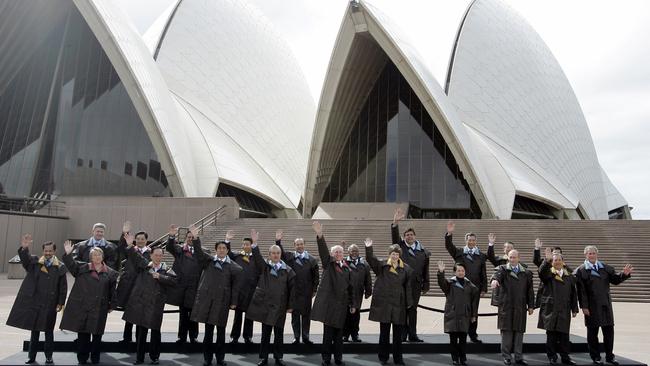 World leaders including former Prime Minister John Howard and US President George W. Bush wearing Drizabone jackets in Sydney in 2007.