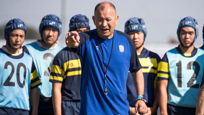 Eddie Jones leads a practice session with Japanese schoolchildren after the England team’s captain's run on Friday. Picture: AFP