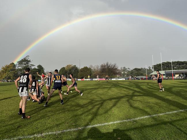 Players compete for the ball under a rainbow during the NFNL Whittlesea v Montmorency football match in Whittlesea, Saturday, June 24, 2023. Picture: Andy Brownbill