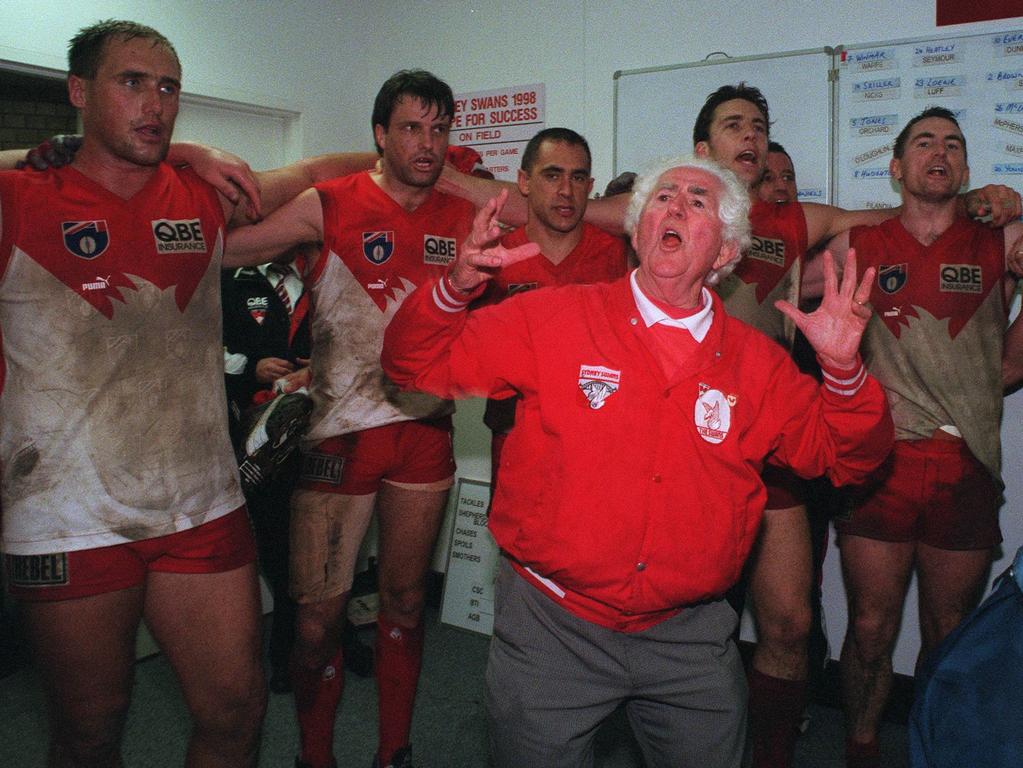 Ken Williams leads the Swans song after a finals win in 1998.