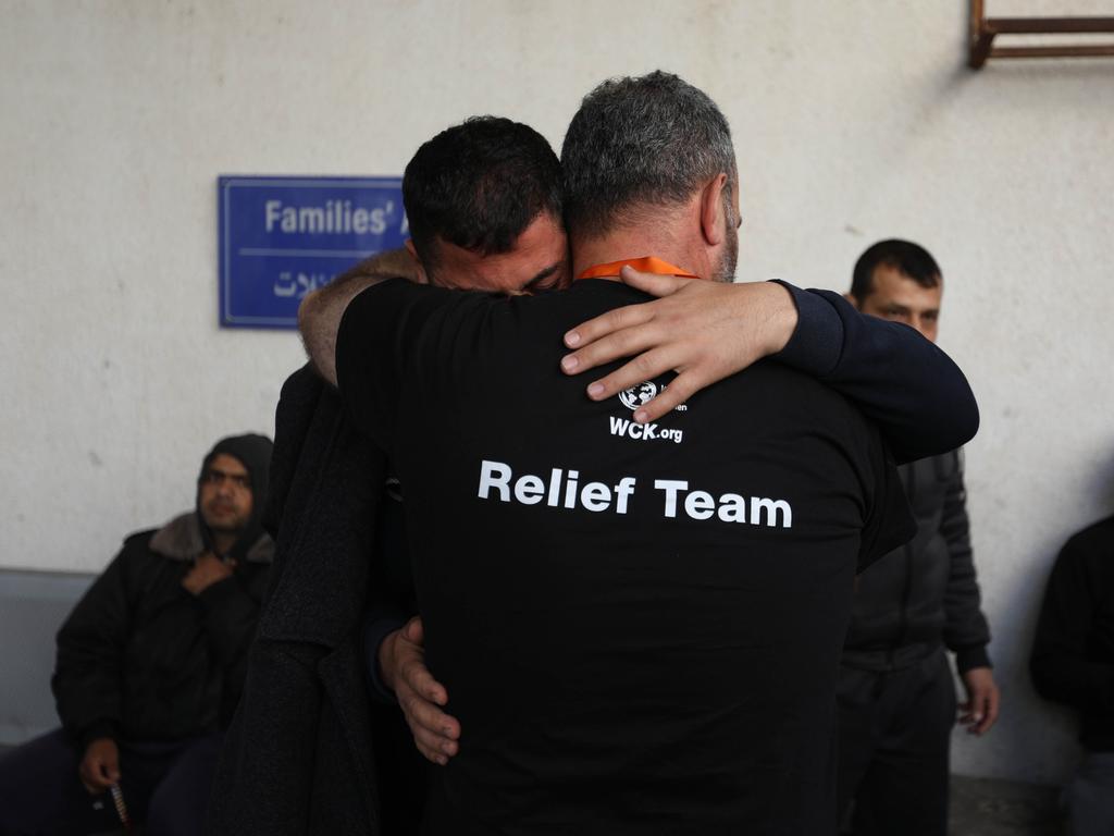 People become emotional as they receive the bodies of World Central Kitchen workers who were killed by Israeli air strikes in Rafah, Gaza. Picture: Getty Images