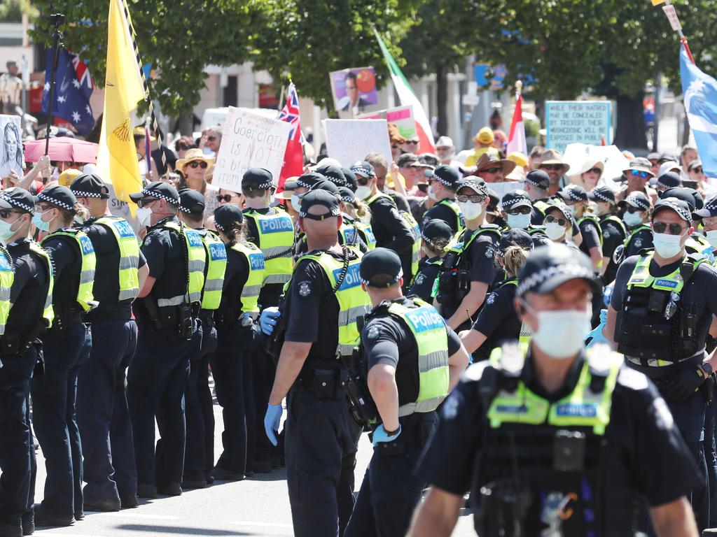 Police monitor protesters near the Australian Open. Photo: NCA NewsWire / David Crosling