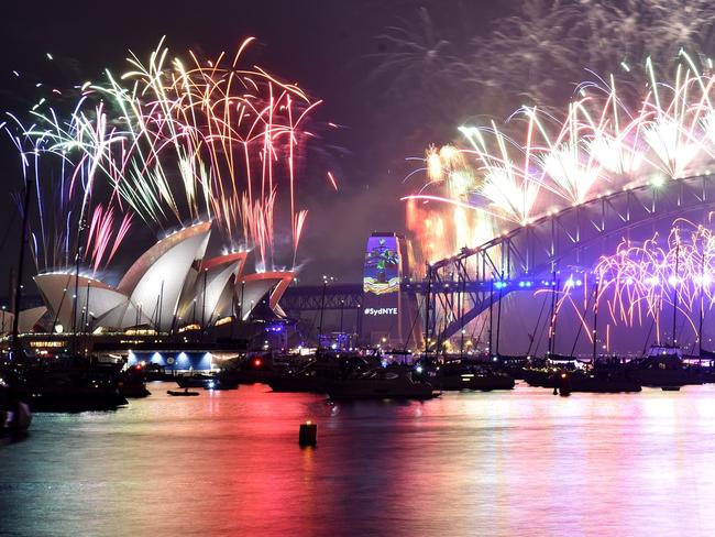 Fireworks erupt over Sydney's iconic Harbour Bridge and Opera House during the New Year’s Eve fireworks show on January 1, 2017. Picture: AFP/Peter Parks