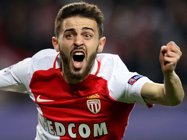 (FILES) A file photo taken on March 15, 2017 at the Stade Louis II in Monaco shows Monaco's Portuguese midfielder Bernardo Silva celebrating after his team scored a goal during the UEFA Champions League football match Monaco and Manchester City. Portuguese playmaker Bernardo Silva is to join Manchester City from French champions Monaco on July 1, 2017 the English Premier League club announced on May 26, 2017. / AFP PHOTO / Valery HACHE