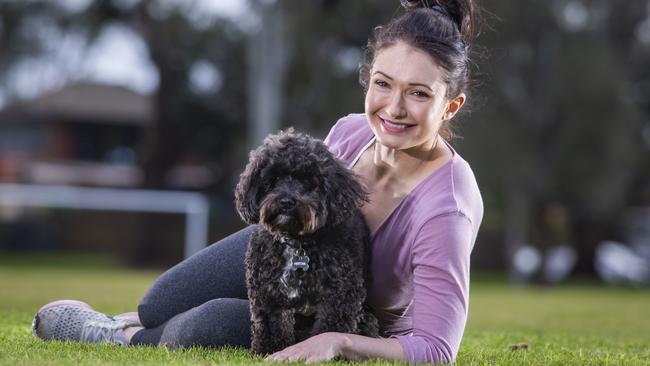 Jessica Tassiou with her cavoodle Clifford who went missing for five days. Picture: Wayne Taylor