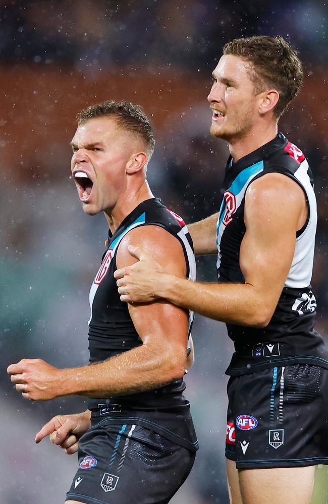 Port Adelaide defender Kane Farrell (R) is looking forward to covering for now Collingwood defender Dan Houston (L). (Photo by Dylan Burns/AFL Photos)