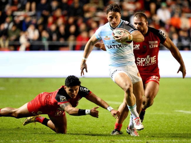 Henry Arundell (C) makes a break while playing for Racing 92 in the French Top14. Picture: AFP