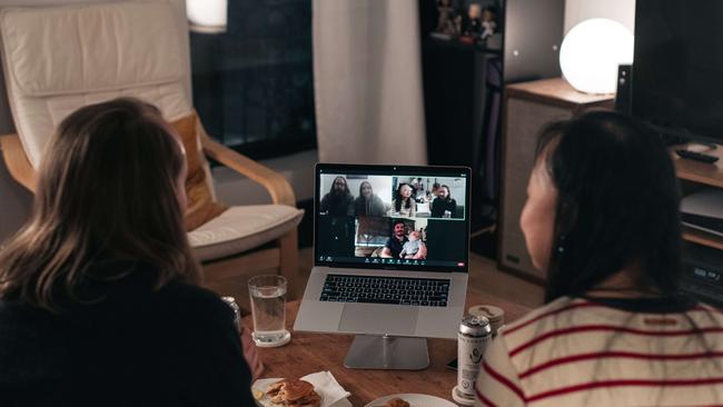 A couple celebrates Thanksgiving with friends by having dinner together over Zoom. Picture: AFP.