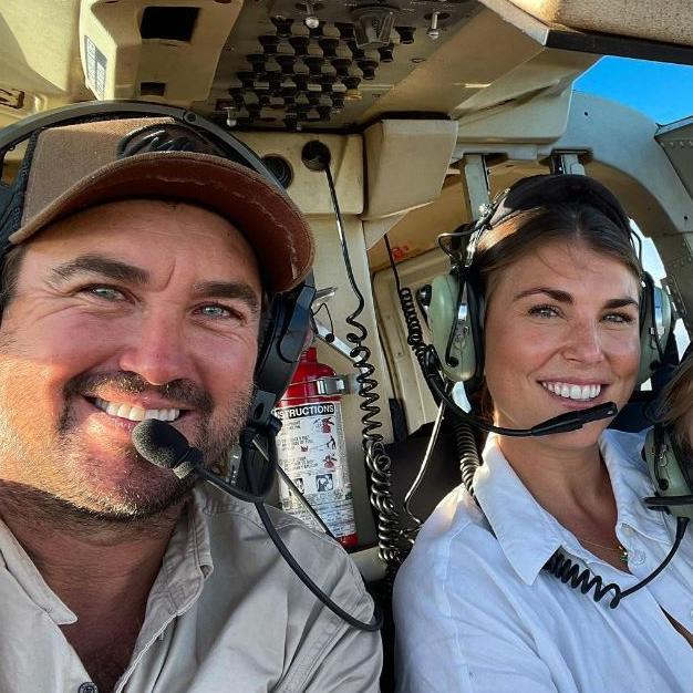 Matt Wright with his wife Kaia in a helicopter/