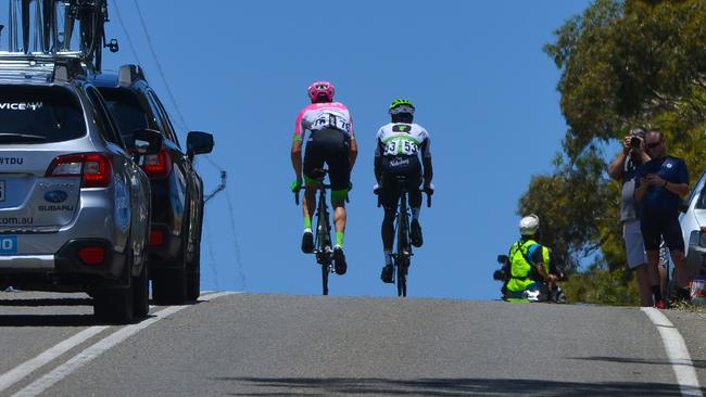 Team Dimension Data rider Nicholas Dlamini, right, leads a breakaway with Education First-Drapac rider Will Clarke (L) on the first day of the Tour Down Under. Picture: AFP PHOTO / BRENTON EDWARDS