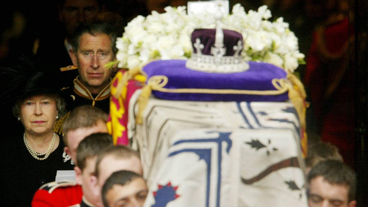 The late Queen and king Charles III walk behind the Queen Mother's coffin following her funeral at Westminster Abbey in central London, April 9, 2002. It was the last time the crown was publicly displayed. Photo: Dan Chung