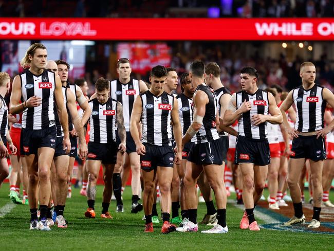 The Magpies walk off the SCG after Friday night’s loss. Picture: Michael Willson/AFL Photos