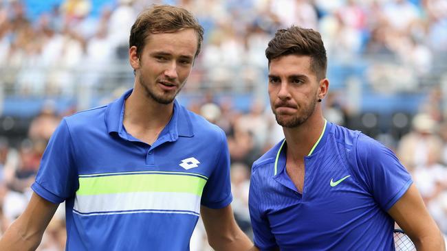 Winner, Daniil Medvedev of Russia (L) shakes hands with runner up, Thanasi Kokkinakis of Australia (R) following their mens singles second round match.