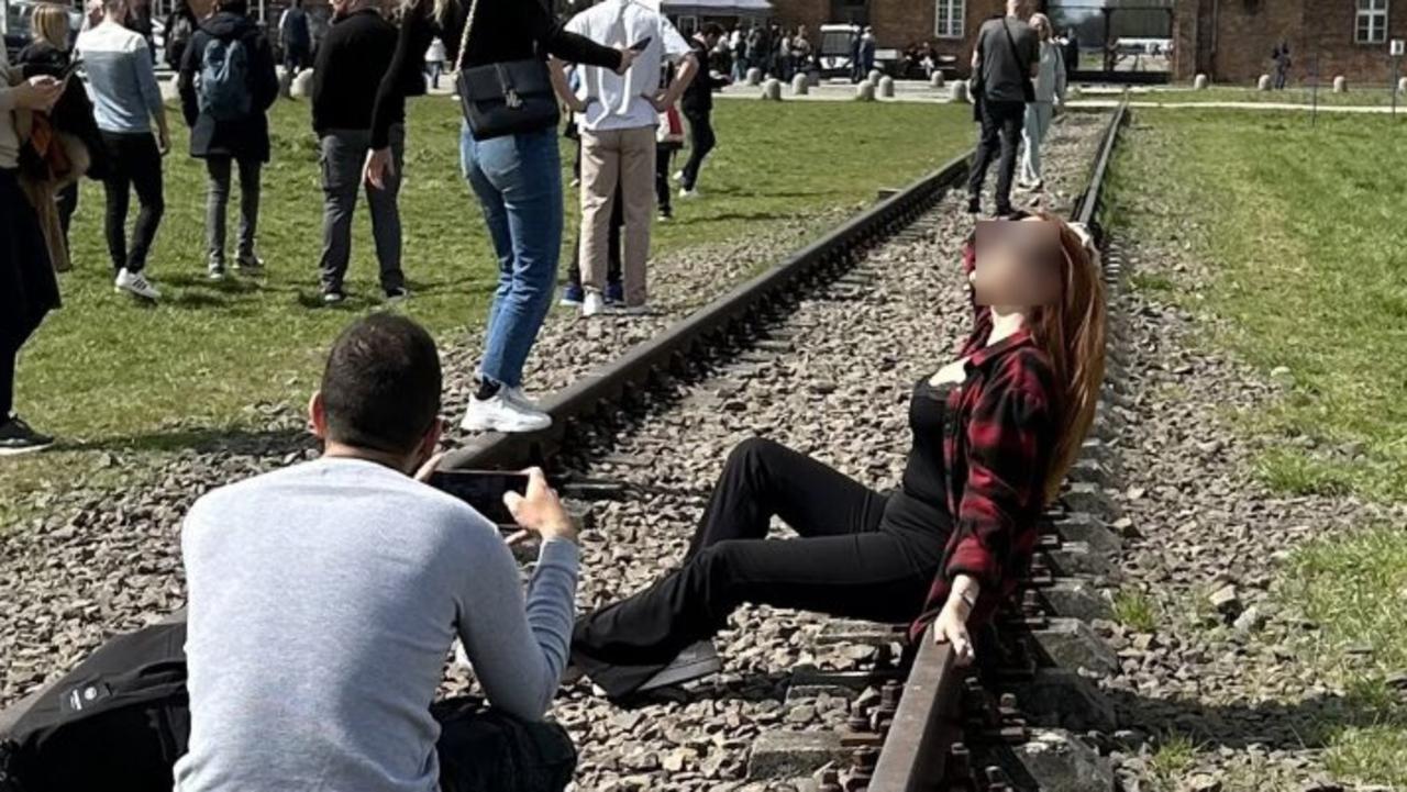 A photo of a woman posing at Auschwitz has gone viral. Picture: Twitter/Maria Murphy