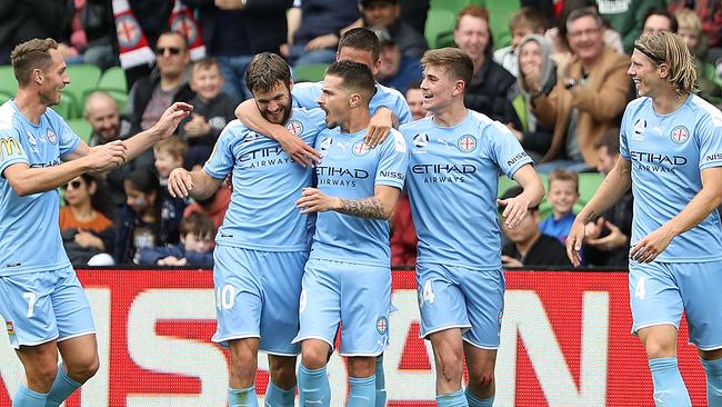 Jamie Maclaren of Melbourne City celebrates after scoring a goal during the round two A-League match between Melbourne City and Adelaide United at AAMI Park.