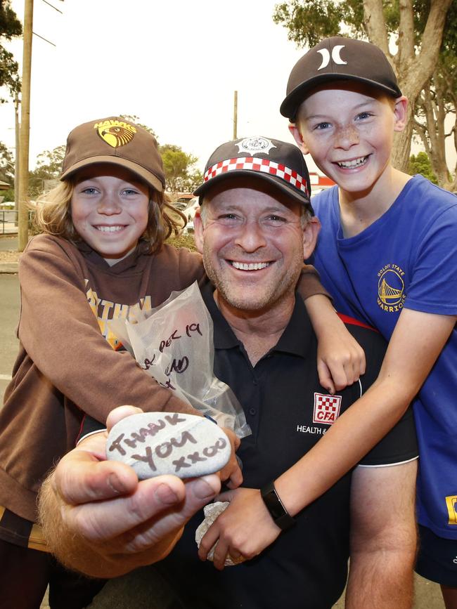 Kids thank the CFA firefighters in Mallacoota. Picture: David Caird