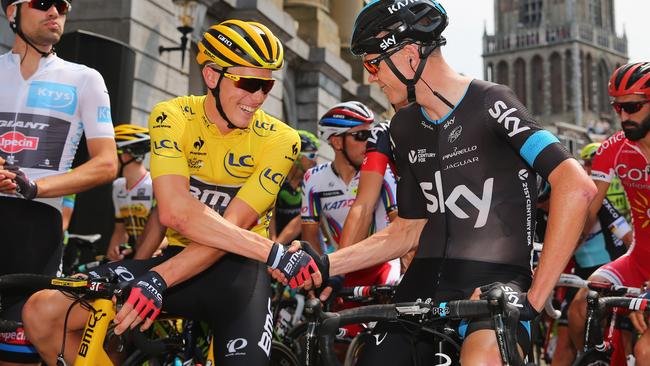 Tour favourite Chris Froome and Australian stage one winner Rohan Dennis shake hands.