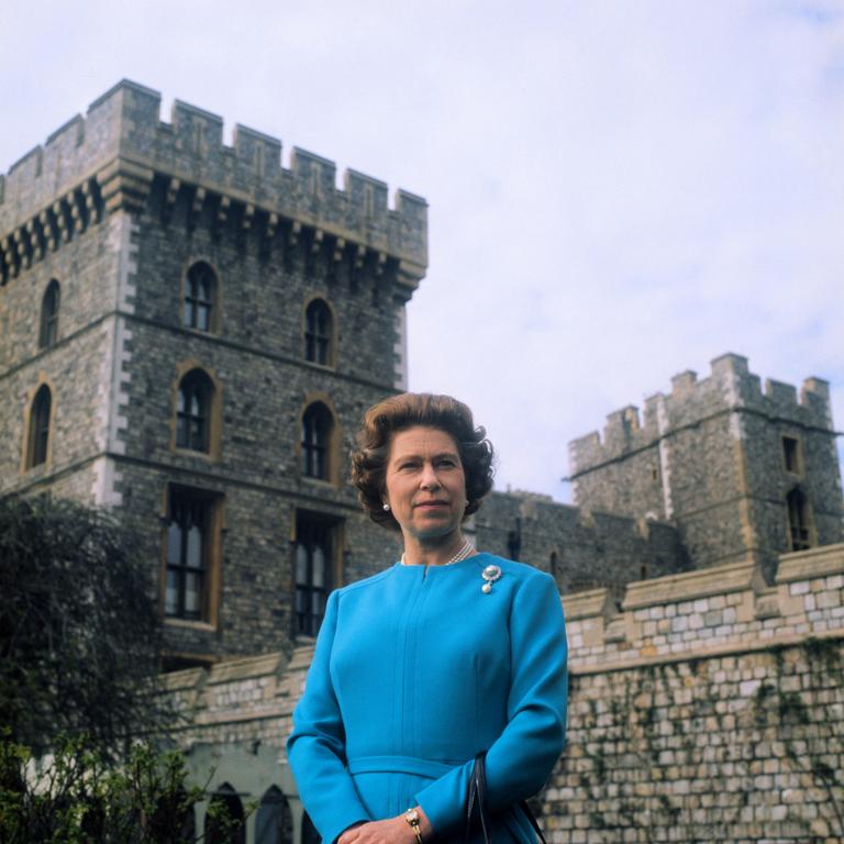 (FILE PICS) (Original Caption) Queen Elizabeth smiles as she poses for official pictures in courtyard of Windsor Castle. The monarch celebrates her 50th birthday 4/21/76.