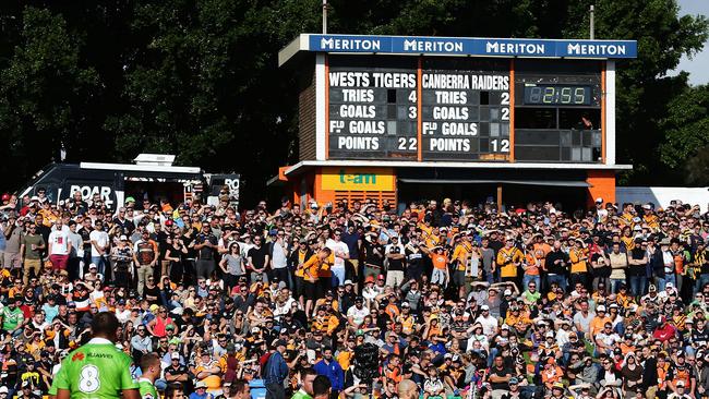 A large crowd watches on during the Wests Tigers v Canberra Raiders rugby league game at Leichhardt Oval, Sydney. Pic Brett Costello