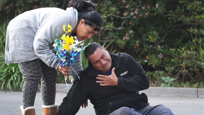 Solomone Taufeulungaki’s aunty Aunty Siualone comforts father Atunaisa following his stabbing death in 2020. Picture: David Crosling.