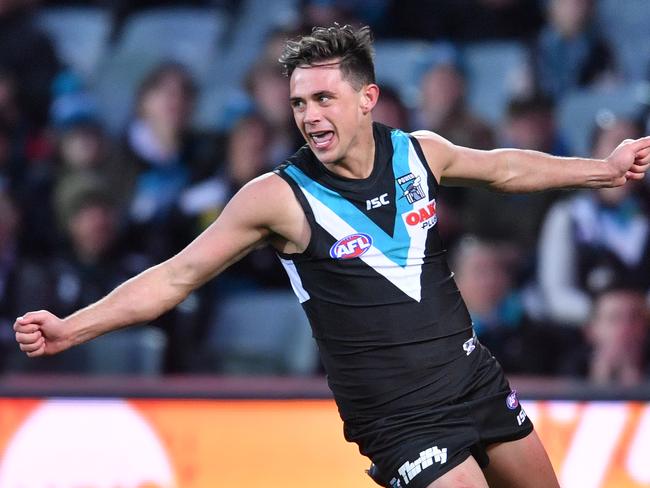 Aidyn Johnson of the Power reacts after scoring a goal during the Round 21 AFL match between the Port Adelaide Power and the West Coast Eagles at Adelaide Oval in Adelaide, Saturday, August 11, 2018. (AAP Image/David Mariuz) NO ARCHIVING, EDITORIAL USE ONLY