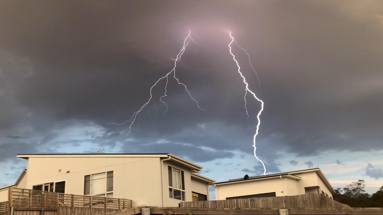 Lightning strikes over a home at Old Beach on Hobart's Eastern Shore. Reader's picture: NICK WOODWARD