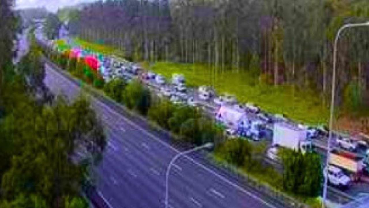 Truckie fights for life after crash brings Pacific Mwy to standstill ...