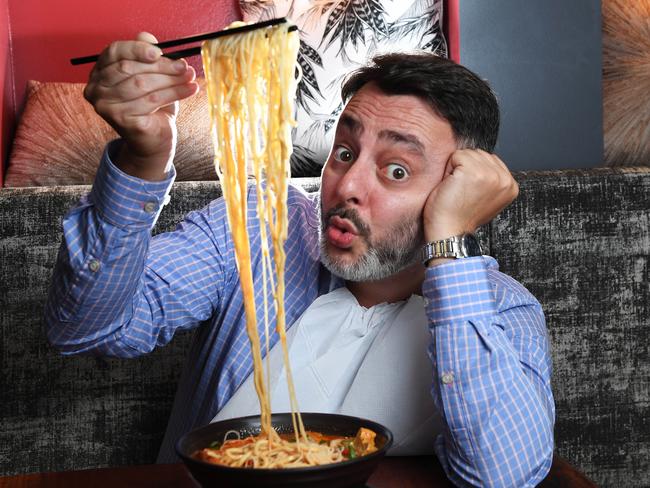 Gino Luglietti who sees himself as the Laksa Legend slurps away  at his favorite laksa place Rendezvous Cafe in the CBD .     As the second annual Laksa Festival kicks off .  Picture Katrina Bridgeford.