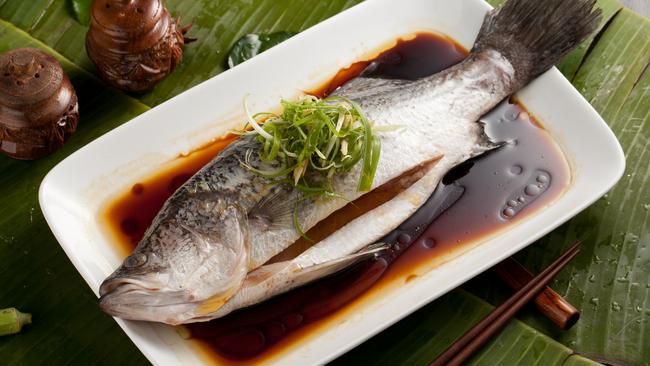 Steamed barramundi with ginger and shallots.