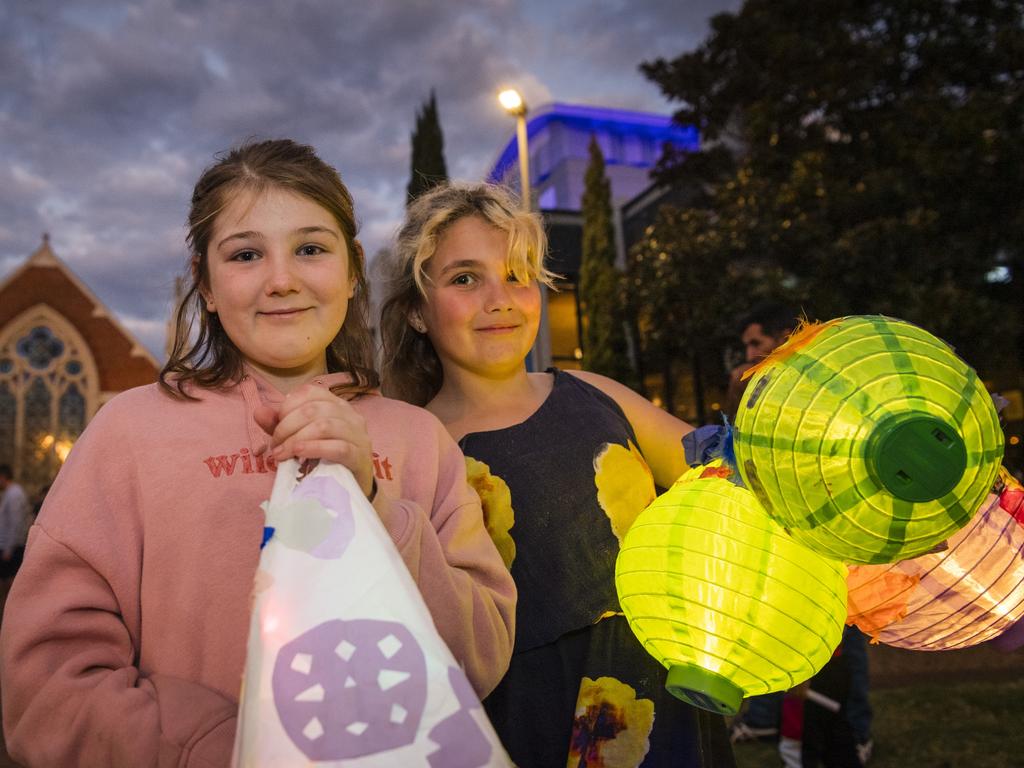 Issabelle Hobbs (left) and Khryalea Ingram at Multicultural Australias Luminous Lantern Parade in the grounds of Empire Theatres, Saturday, August 12, 2023. Picture: Kevin Farmer