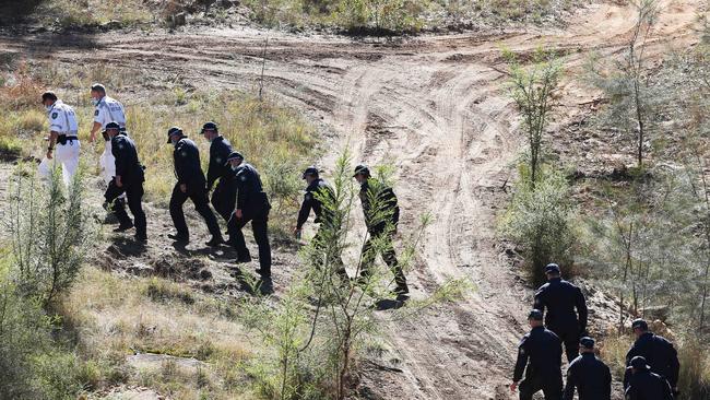 Public Order and Riot Squad members take to the hills around where three year old Anthony AJ Elfalak went missing on Friday. Picture: NCA NewsWire / Peter Lorimer.