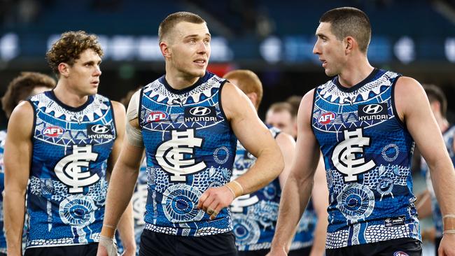 MELBOURNE, AUSTRALIA - MAY 21: Patrick Cripps (left) and Jacob Weitering of the Blues look dejected after a loss during the 2023 AFL Round 10 match between the Carlton Blues and the Collingwood Magpies at the Melbourne Cricket Ground on May 21, 2023 in Melbourne, Australia. (Photo by Michael Willson/AFL Photos via Getty Images)