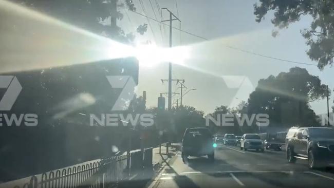 Bright sunlight glares into the driver's cabin as a vehicle approaches the Kensington Rd lights where two teenagers were struck. Picture: 7NEWS